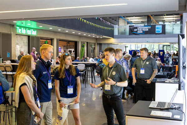 Group of people discussing at conference